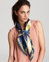 Paired with a neutral ensemble, this abstract silk scarf from Emilio Pucci adds polished perfection.