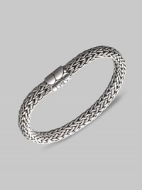 From the Kali Collection. An intricately woven strand of sterling silver with a textured barrel clasp. Sterling silver Length, about 7½ Push-lock clasp Made in Bali.