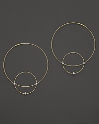 Like magic, smaller hoops balance on 14K gold counterparts.