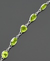 Shape your look with glowing green peridot (6-9/10 ct. t.w.). Bracelet features round, heart and oval cuts set in 14k white gold. Approximate length: 7 inches.