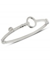 Unlock your new look with this bangle bracelet from Fossil. Features a bent key accent with clasp closure. Crafted in polished stainless steel. Approximate diameter: 2 5/8 inch.