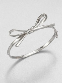 A sweet piece featuring a structured bow design. Rhodium-plated brassDiameter, about 2Hinged closureImported 