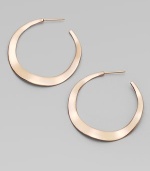 Simple, subtle wavy hoops, in sterling silver and 18k gold, glow with the warm finish of 18k rose goldplating.18k gold and sterling silver with 18k rose goldplatingDrop, about 1½PiercedImported