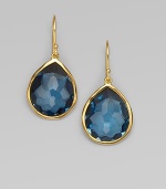 A deeply hued, richly faceted teardrop of London blue topaz shimmers within a delicate setting of 18k gold. London blue topaz 18k yellow gold Drop, about 1¼ Ear wire Imported