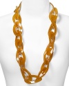 The 60's-inspired look of this amber-toned disc necklace from Kenneth Jay Lane makes it a Mod-chic way to punctuate every outfit. It's vintage perfect with this season's punchiest prints and a pair of platforms.