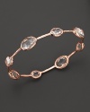 Rose gold, set with clear, faceted quartz stations, is elegant alone--and striking when stacked. By Ippolita.