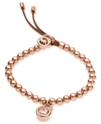 Michael Kors' beautifully-beaded padlock bracelet is crafted in rose-gold tone steel with an adjustable brown leather clasp. Features a glass accent at the padlock charm and a logo charm at the closure. Bracelet also stretches to fit wrist. Approximate diameter: 2-1/4 inches.