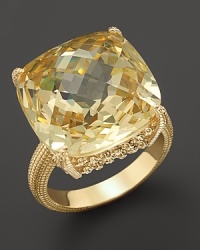 An elegant 18K gold ring with cushion cut canary crystal stone. By Judith Ripka.