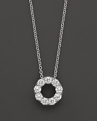 A lovely diamond circle pendant necklace in diamond and 14 Kt. white gold.