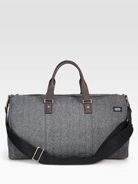 Inspired by suiting fabrics, this wool herringbone is a classic men's fabrication crafted for the stylish traveler.Zip closureDouble top handlesAdjustable shoulder strapWool/leather20W x 11H x 9DImported