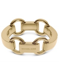 Slip on this linked style for the perfect finishing touch. This Michael Kors bracelet features chunky details with engraved logos. Crafted in gold tone brass. Approximate length: 8 inches. Approximate width: 1 inch.