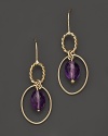 Faceted oval amethyst adds rich sparkle to links of 14K yellow gold. By Nancy B.