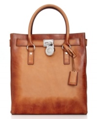 A classic design with artisanal appeal, this undecidedly exquisite tote from MICHAEL Michael Kors is an absolute essential. Butter-soft, dyed leather lends a laid-back look, while the lleaming signature hardware gives the bag posh appeal.