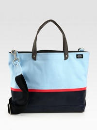 Tote your belongings around town in style this season with this structured canvas bag, dipped in rubber latex for added protection, in contrasting colors that lends a nautical feel to a contemporary design.Double top handlesAdjustable shoulder strapInterior zip pocketCanvas14W x 16H x 6DImported