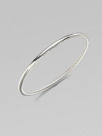 From the Bangle Collection. A single bangle of sterling silver, smooth on the outside and cabled on the inside, to wear alone or with others. Sterling silver Width, about ¼ Diameter, about 2½ Imported 