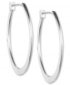 Big-time fashion. Anne Klein's oval-shaped hoops are a must-own this season. Crafted in imitation rhodium-plated mixed metal. Approximate diameter: 3/4 inch.