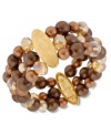 Quite a stretch. Kenneth Cole New York's stretch bracelet is crafted from gold-tone mixed metal with oval accents, as well as rows of brown glass pearls and beads for a stunning statement. Item comes packaged in a signature Kenneth Cole New York Gift Box. Approximate length: 7-1/2 inches. Approximate width: 1-1/5 inches.