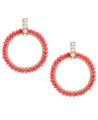 Amp up your wardrobe with a bold pop of color. Betsey Johnson's 80s-themed doorknocker earrings feature faceted red beads and crystal accents at the post. Approximate drop: 3 inches.