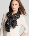 Artsy brushstrokes lend a graphic look to a cozy woven Aqua scarf.