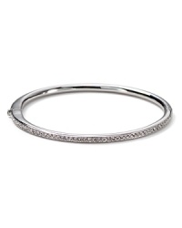 The slender bangle from Nadri is crafted in polished rhodium plate with a single-row of gleaming crystal pave to a bring a touch of light.