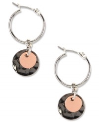 Don't let your style drop off! Keep your look fresh with these Nine West hoop earrings with a circular drop pendant. Crafted in silver tone, rose-gold tone and hematite tone mixed metal. Approximate drop: 1-1/2 inches. Approximate diameter: 5/8 inch.