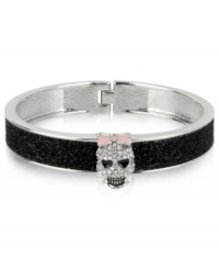 A look to die for. Betsey Johnson's hinged bangle bracelet features black glitter details and glass crystal accents in the form of a spruced-up skull for a fun effect. Approximate diameter: 2-1/4 inches.