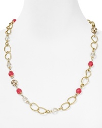 Milly's ethereal arrangement of beads and pink rhinestone fireballs on chain link.