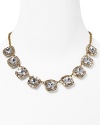 Paint the town gold with this kate spade new york statement necklace, accented by a bib of bold crystal stone stations. It's a luxe layering piece.