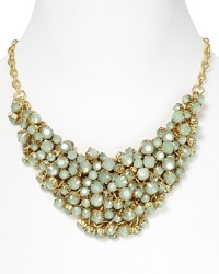 A cluster of mint green stones adorn this gold chain necklace from Aqua.