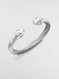 From the Silver Ice Collection. A signature Yurman cable of sterling silver, richly enhanced by bands of pavé diamonds encircling lustrous white freshwater pearl end caps. Diamonds, 0.48 tcw White freshwater pearls Sterling silver Cable, 7mm Diameter, about 2¼ Made in USA