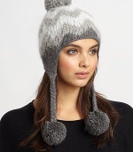 This ultra-soft, ultra-toasty knit hat is crafted in an eye-catching herringbone design with braided straps and pom-poms.Baby alpaca/merino/bambooDry cleanMade in the USA