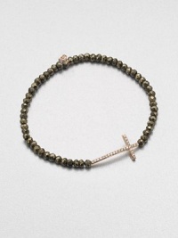 A delicate diamond accented 14k rose gold cross on a stunning pyrite beaded stretch bracelet. Diamonds, .14 tcw14k rose goldPyriteDiameter, about 2.5Slip-on styleImported 