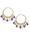 Head-turning elegance from Lauren Ralph Lauren. These textured hoop earrings take a modern approach with colorful beads fashioned from resin and glass. Crafted in 14k worn gold-plated brass. Approximate drop: 1-1/2 inches. Approximate diameter: 1-1/4 inches.