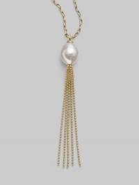 A striking white baroque pearl is the centerpiece of this delightful design, accented with a tassel of delicate gold chains. 16mm baroque, organic, man-made white pearl 18k gold vermeil Length, about 36 Made in Spain