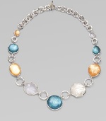 From the Wonderland Collection. Shapely doublets in rich tones of honey and denim combine color-backed mother-of-pearl and faceted clear quartz, spaced along with uncolored stones on a bold sterling silver chain.Mother-of-pearl and clear quartzSterling silverLength, about 18Toggle claspImported