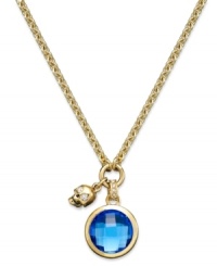 Walk on the edge with this Juicy Couture charm necklace. A circular glass stone in shimmering blue hues is paired with a skull charm for added toughness. Crafted in gold tone mixed metal. Approximate length: 16 inches. Approximate drop: 1-1/2 inches.