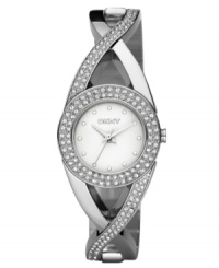 Celebrate a beautiful life with this stunning watch by DKNY. Crystal-accented stainless steel bracelet and round case. Crystal accents at bezel. Silvertone matte dial with tonal markers and logo. Quartz movement. Water resistant to 50 meters. Two-year limited warranty.