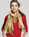 For a classic winter look, wrap up in Echo's plaid-patterned woven scarf with long fringe edges.