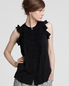 Ruffled sleeves and petite bows flourish this DIANE von FURSTENBERG top of supple stretch silk with feminine charm.