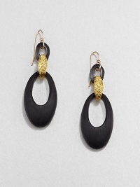 From the Lucite Collection. Sleek oval loops of hand-painted, hand-sculpted Lucite are connected by a golden bale with a rich pebble texture.LuciteGoldtoneLength, about 2.4Ear wireMade in USA