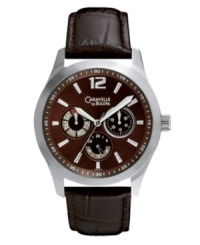 A sharp dress watch in rich, saturated browns. By Caravelle by Bulova. Brown croc-embossed leather strap and round silver tone mixed metal case. Brown dial features silver tone numeral at twelve o'clock, stick indices, three multifunctional subdials, three hands and logo. Quartz movement. Water resistant to 30 meters. Two-year limited warranty.