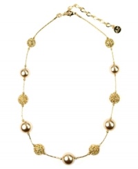 Warm up to eye-popping hues. AK Anne Klein's shimmering strand necklace, embellished with topaz-colored glass pearls and gold tone crystal pave balls, is crafted in gold tone mixed metal. Approximate length: 16 inches + 3-inch extender.