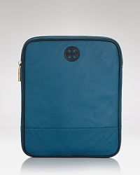 Ever-durable nylon constructs this sleek Tory Burch iPad case, detailed with the label's signature hardware.