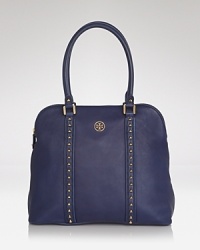 Studded details lend a subtle edge to this very poised Tory Burch tote, styled in leather. With pointed toe pumps and a pencil skirt the look's Park Avenue polished.