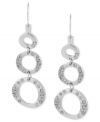 Kenneth Cole New York proves to be well-rounded with this pair of drop earrings. Crafted from silver-tone mixed metal, the earrings dazzle with glass pave crystal accents adorning the three circles. Approximate drop: 2 inches.