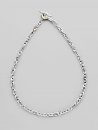 Sterling silver and 18k gold small figaro chain. Toggle closure 18 long Imported