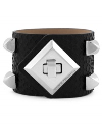 Rough and ready style from Vince Camuto. This chic cuff bracelet features silver tone stud and turnlock details. Crafted with black snake-embossed leather. Approximate length: 8-1/2 inches. Approximate diameter: 2-1/2 inches.