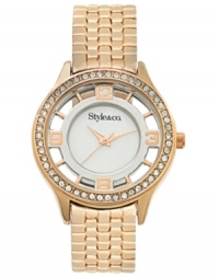 Style&co. reveals everything with this transparent timepiece adorned with rosy hues and crystal sparkle.