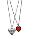 Hearts in the right place. This two-row necklace from GUESS is crafted from hematite-tone mixed metal with two heart pendants providing plenty to love. Item comes packaged in a signature GUESS Gift Box. Approximate length: 15 inches + 2-inch extender. Approximate drop: 1-1/4 inches.