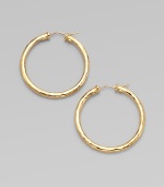 From the Martellato Collection. Graceful hoops with a rich hammered texture in gleaming 18k gold.18k yellow goldDiameter, about 1¾PiercedMade in Italy